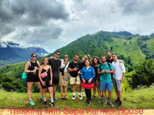 a group of people standing on top of a mountain at SaPa Farmer House in Sa Pa