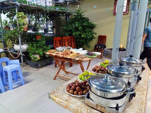 a buffet of food on a table with plates of food at Hoa Sua Hotel in Vung Tau