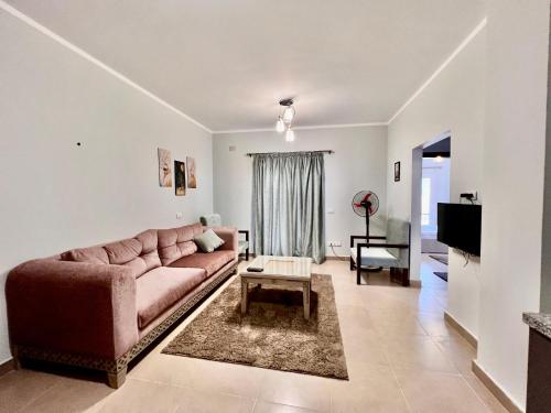 a living room with a couch and a table at Blue Residence Dahab in Dahab
