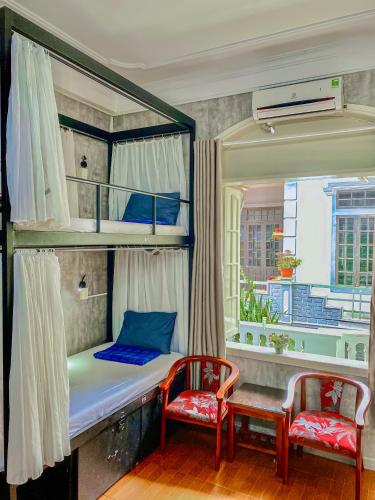 Ένα ή περισσότερα κρεβάτια σε δωμάτιο στο Amy Hostel Hue