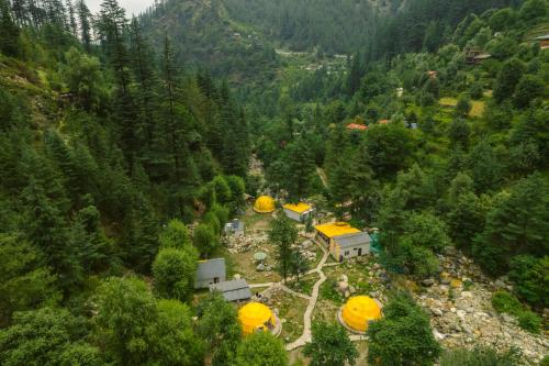 an aerial view of a house in a forest at Whoopers Boutique Resort Jibhi in Jibhi