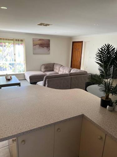 a living room with a couch and a table at Tupper Retreat in Boulder