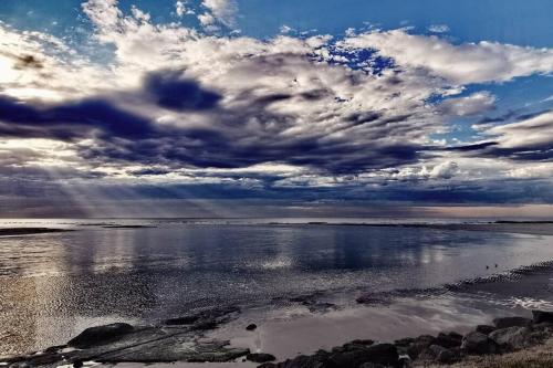 a cloudy sky over a body of water at Waterview luxury hideaway, 2 min walk to all, pool in The Entrance