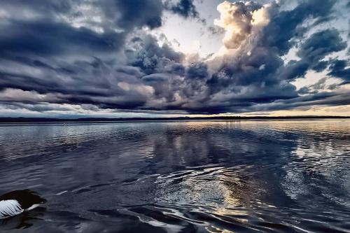 a cloudy sky over a large body of water at Waterview luxury hideaway, 2 min walk to all, pool in The Entrance