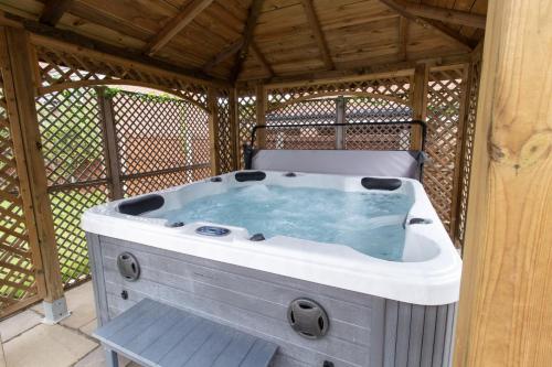 a large hot tub in a gazebo at Ketley Vallens in Telford