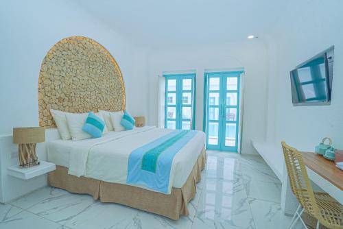 Katil atau katil-katil dalam bilik di Loccal Collection Hotel Komodo