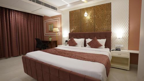 a bedroom with a large bed in a hotel room at The Shanti A Boutique Hotel in Jodhpur