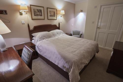 A bed or beds in a room at The Court House 