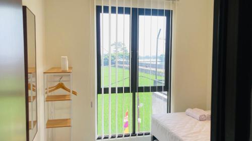 Postel nebo postele na pokoji v ubytování Nata Villa Syariah close to Telkom