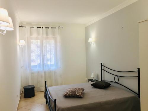 Llit o llits en una habitació de Villa Andalù Appartamenti