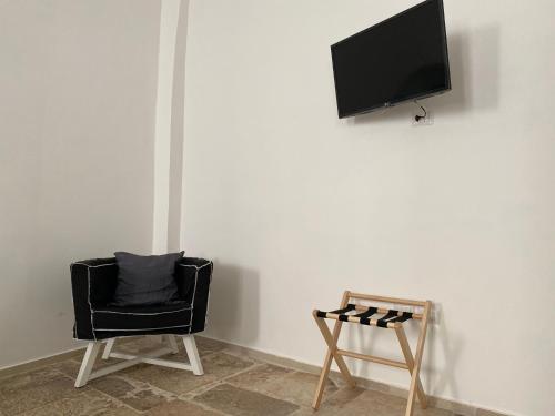 TV a/nebo společenská místnost v ubytování Al Duomo Rooms
