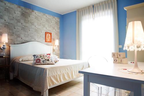 Postel nebo postele na pokoji v ubytování B&B La Chora Di Paestum