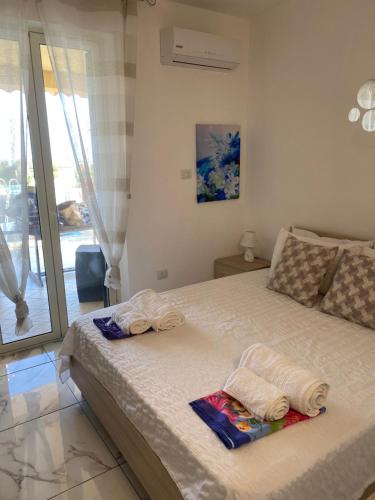 Postel nebo postele na pokoji v ubytování Casa Vacanze Villa Mimosa- per le vacanze vicino a Tropea