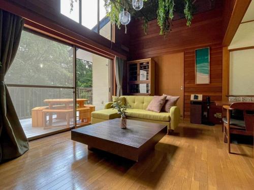 a living room with a couch and a coffee table at Villa Verde 那須 in Nasu