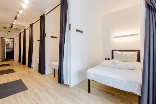 Postel nebo postele na pokoji v ubytování RadZone Hostel