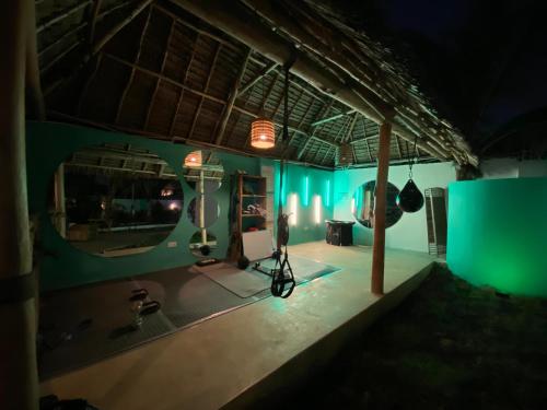 a room with a stage with a camera and a mirror at Zen Boutique Resort in Jambiani