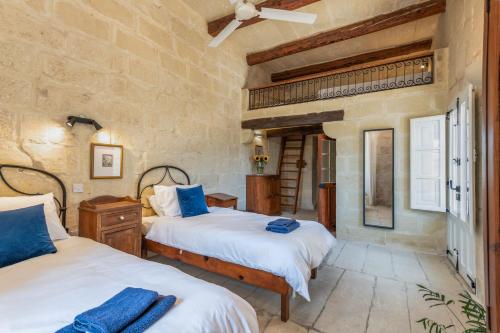 Voodi või voodid majutusasutuse Gozo Escape toas