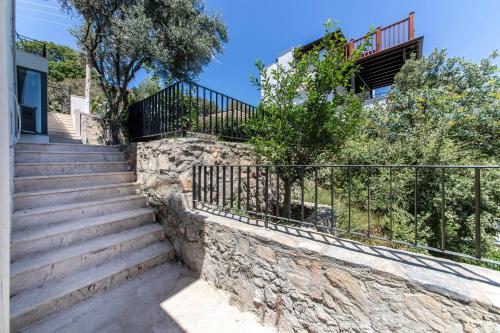 a set of stairs leading up to a house at Villa House Apart Türkbükü in Bodrum City