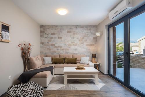 a living room with a couch and a table at Villa Emma Pag in Pag