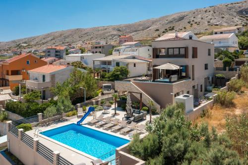 an image of a house with a swimming pool at Villa Emma Pag in Pag