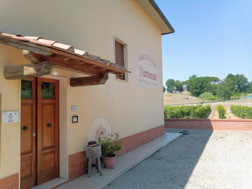 a entrance to a building with a wooden door at Agriturismo Barbarino in Vinci