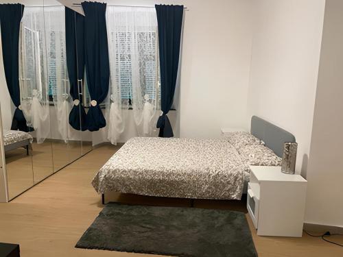 a bedroom with a bed and a mirror at Dalla Laretta di fronte all Acquario di Genova in Genoa