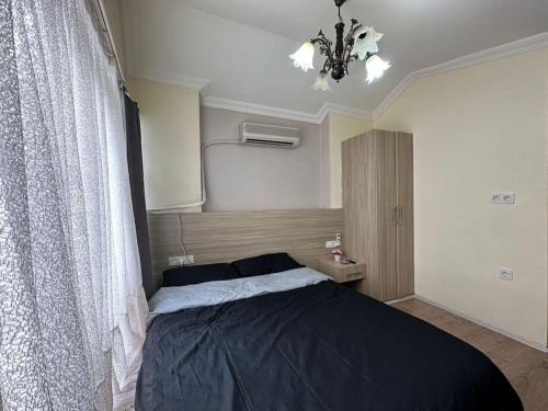 Postel nebo postele na pokoji v ubytování Beyoğlu Taksim'de Stüdyo Daire