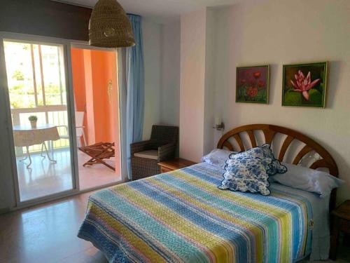 Postel nebo postele na pokoji v ubytování Acogedor apartamento con 3 piscinas en primera línea de playa