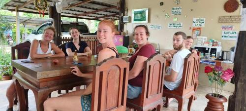 a group of people sitting at a table at JJ&J Garden in Pai