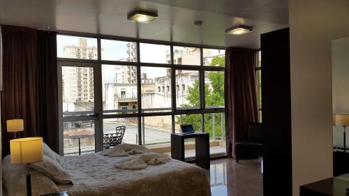 Ένα ή περισσότερα κρεβάτια σε δωμάτιο στο Hotel del Sol