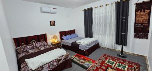 Ένα ή περισσότερα κρεβάτια σε δωμάτιο στο Petra Magic Guest House