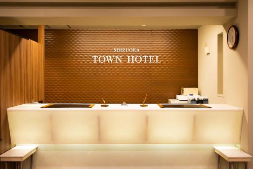 a view of a town hotel lobby with a counter at Shizuoka Town Hotel in Shizuoka
