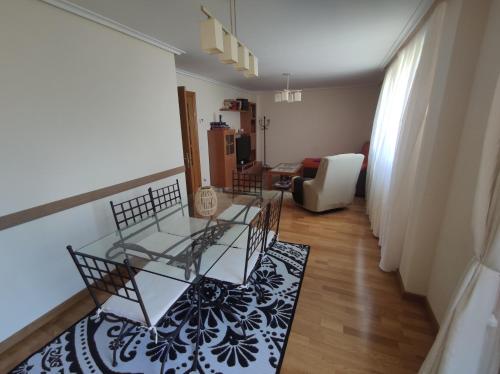 a living room with two chairs and a table at Casa San Miguel in Huércanos