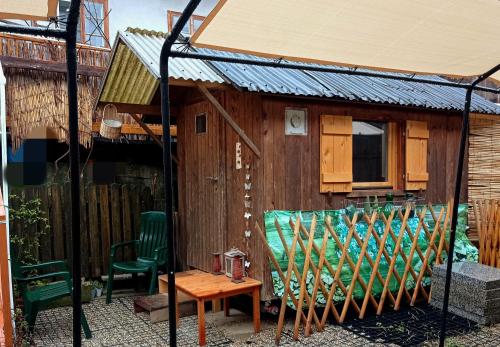 a patio with a table and chairs and a house at A-Sissy-Hof in Bischofstetten