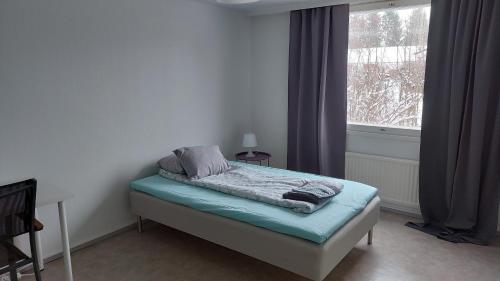 Ένα ή περισσότερα κρεβάτια σε δωμάτιο στο Apartment in Kauhajoki, Yrjöntie 5
