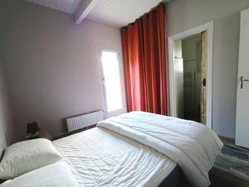 Ένα ή περισσότερα κρεβάτια σε δωμάτιο στο Le Petit Bond : gîte à la campagne près d'Auch