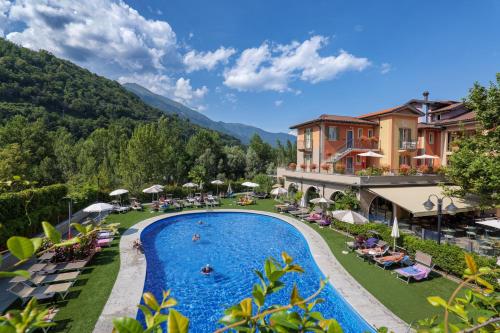 an image of a resort with a swimming pool at Aquazzurra Resort & Aparthotel in Cannobio