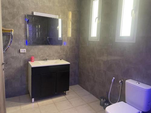 a bathroom with a sink and a toilet at Villa Belle-Vue in Tabarka