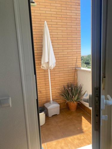 a bathroom with a toilet with a towel on it at Las cerezas in Ciudad Real