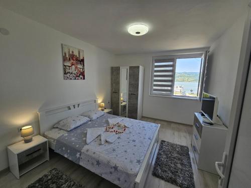 Postel nebo postele na pokoji v ubytování Apartman Jovanovic