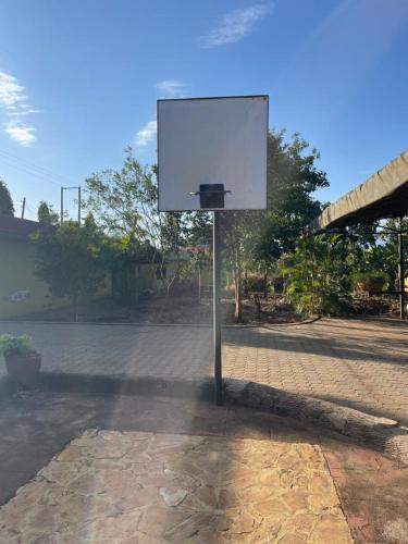 a basketball hoop in the middle of a street at ULTRA HOME-Private House in Arusha