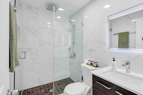 a bathroom with a shower and a toilet and a sink at Miami Luxury Home! Next to Miami airport and beach in Miami