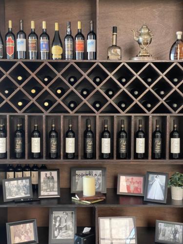 a wall of wine bottles in a wine cellar at Mizirawi Historic Hotel in Ramallah