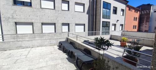 a row of benches on the side of a building at Hotel Brisa del Mar in O Grove
