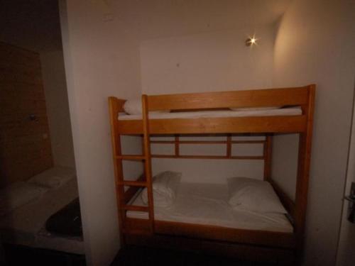 a group of bunk beds in a room at GOURETTE PIED DES PISTES in Eaux-Bonnes