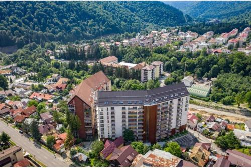 an overhead view of a city with buildings and trees at BELLE VIEW SINAIA in Sinaia