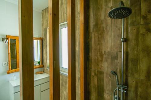 a bathroom with a shower and a sink at Blue Planet São Jorge Azores - RRAL nº 1341 in Velas