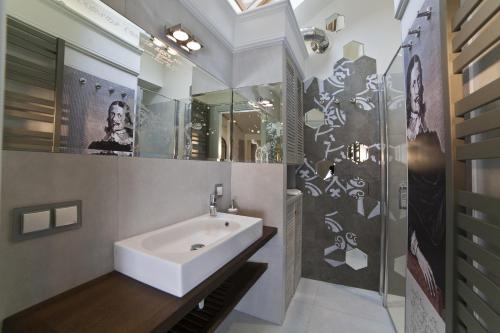 a bathroom with a sink and a shower at Patio Apartments - Old Town in Gdańsk