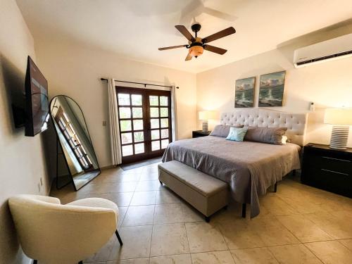 a bedroom with a bed and a ceiling fan at Sandy Beach Costa Diamante E15 House Game Room Dog Friendly in Puerto Peñasco