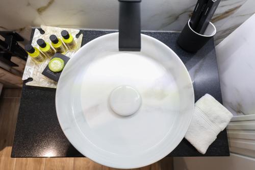 a white plate on a counter in a kitchen at Vila Kace in Korçë